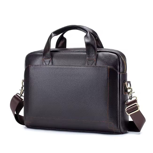 A coffee brown leather briefcase with two handles and a detachable shoulder strap